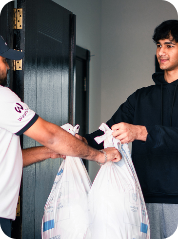 WashOn team collecting laundry from a Dubai doorstep