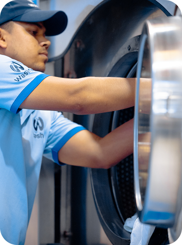 WashOn team cleaning clothes at the Dubai facility